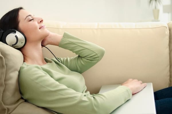 woman relaxing and listening to music