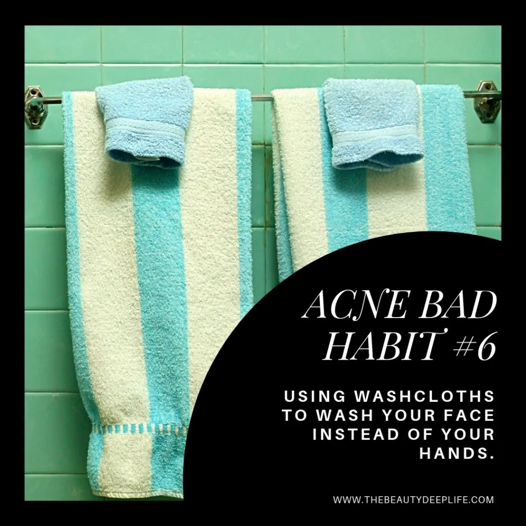 wash cloths on the bathroom wall with text overaly- acne bad habit #6
