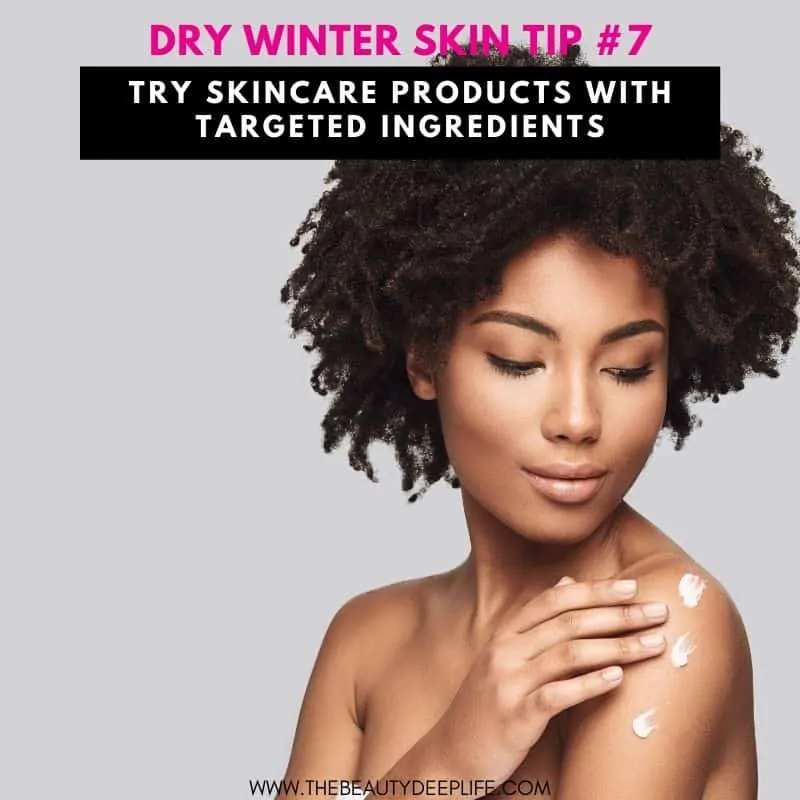 Woman applying skincare moisturizer for dry winter skin to her shoulder