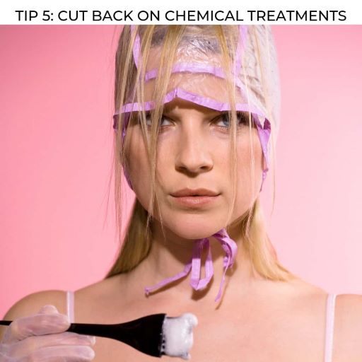 woman using hair dye with text overlay - tip 5 cut back on chemical treatments