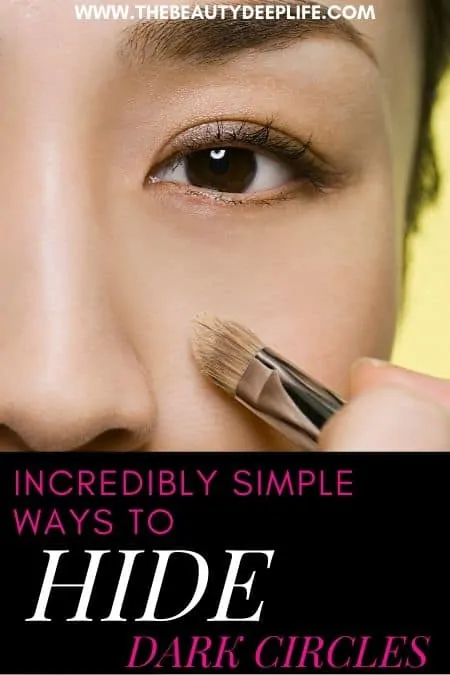 Woman using makeup to hide dark circles