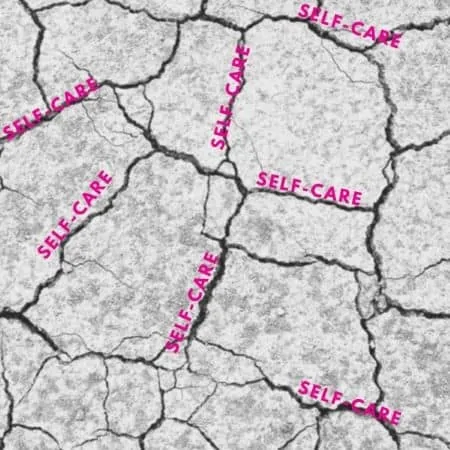 Cracks in the ground with the word self-care slipping in the cracks