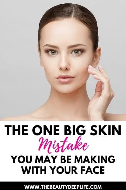 woman touching her face holding a skincare product with text overlay - the one big skin mistake you may be making with your face