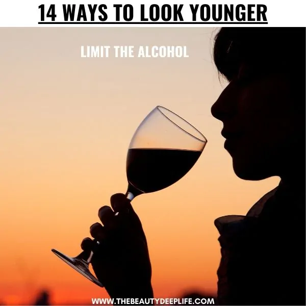 woman drinking wine with text overlay 14 ways to look younger
