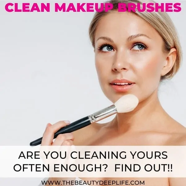 woman holding makeup brush and thinking with text overlay - clean makeup brushes are you cleaning yours often enough