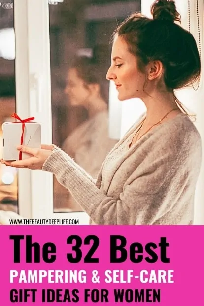 woman holding a gift box with text overlay the 32 best pampering and self-care gift ideas for women