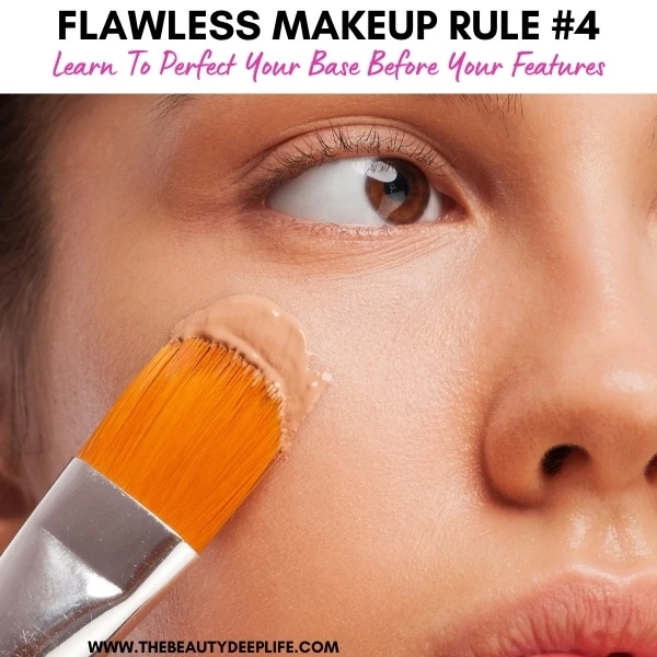 woman applying foundation makeup