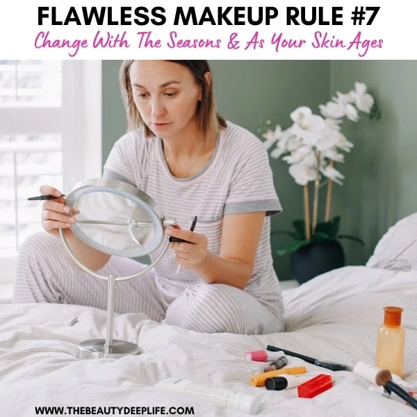 woman applying her makeup