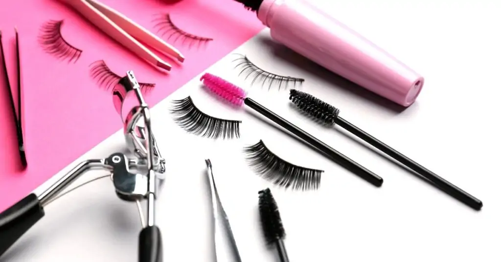 eye makeup tools lash curler tweezers and false lashes