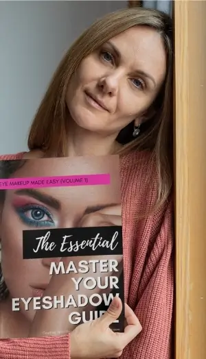 woman holding eyeshadow guide book