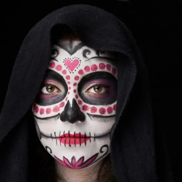woman with day of the dead halloween makeup idea