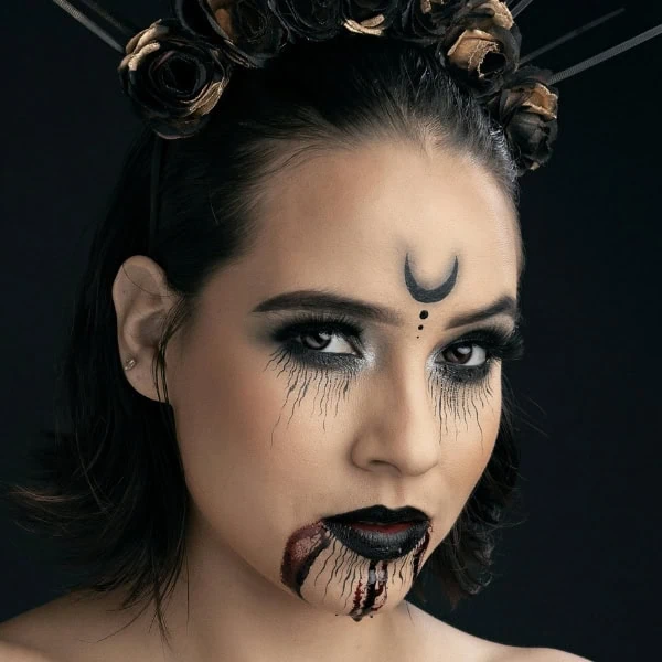 woman with gothic witch halloween makeup