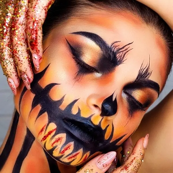 woman with glamorous pumpkin head makeup idea