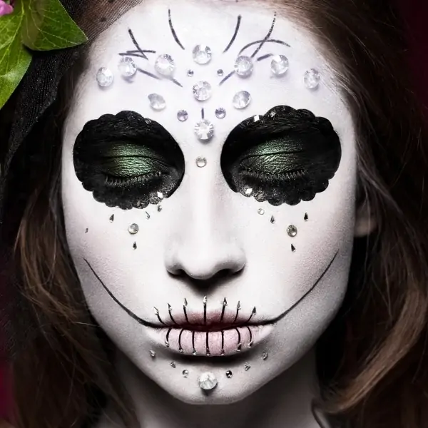 day of the dea halloween makeup on woman's face
