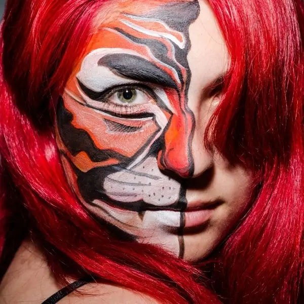 woman with half tigress halloween makeup look