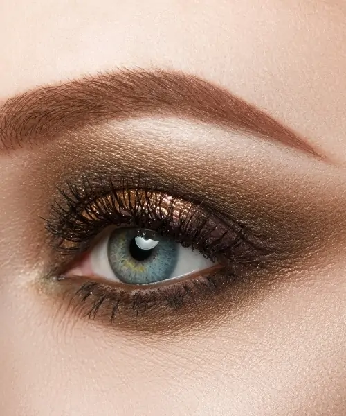 woman with blue eyes and a brown eyeshadow 