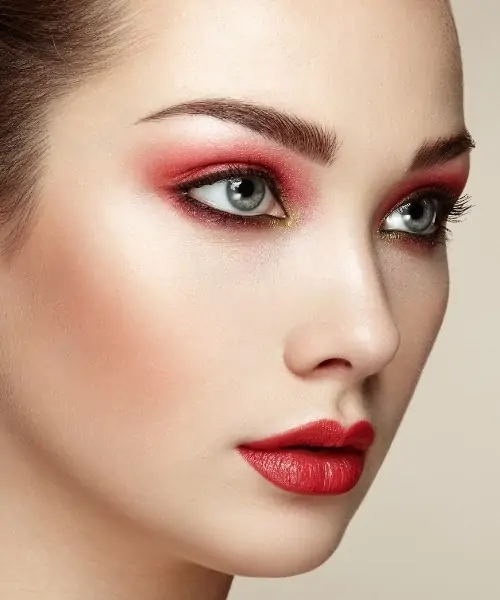 woman with a red eyeshadow look for blue eyes