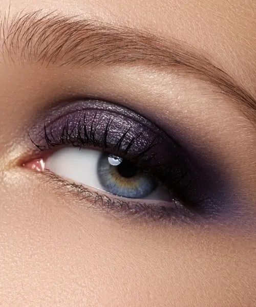 woman with purple eyeshadow looks for blue eyes