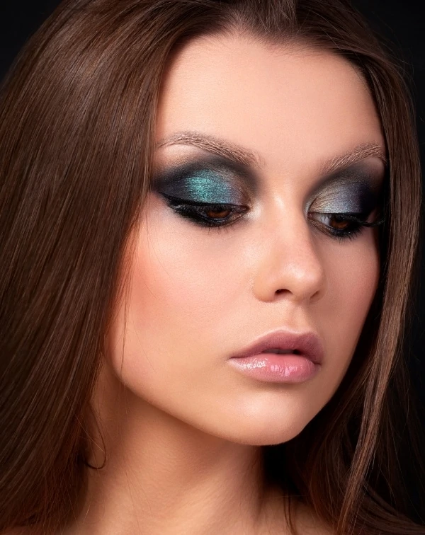 woman with blue eyeshadow look for her brown eyes