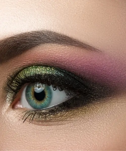 woman with blue-green eyes and colorful eyeshadow