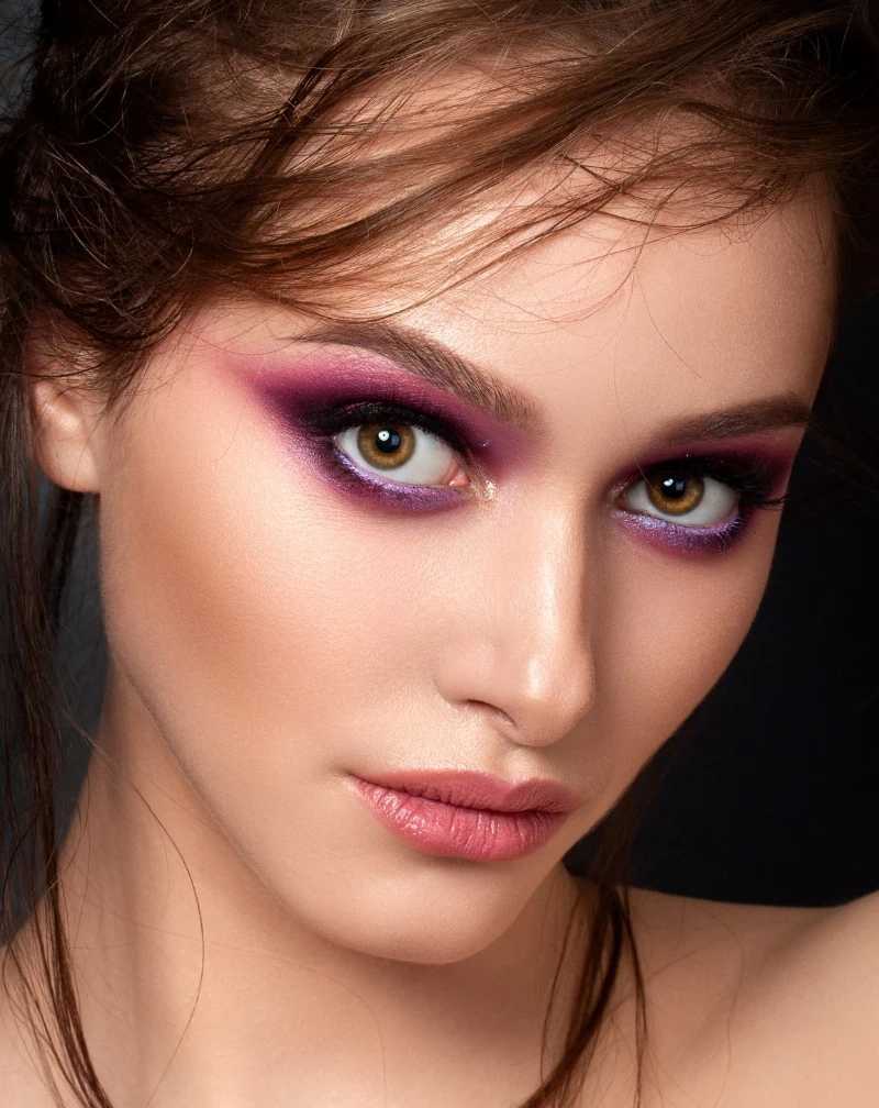 woman with brown eyes and purple eye makeup look