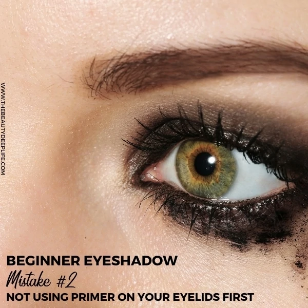 woman with smeared and smudged eye makeup with text overlay beginner eyeshadow mistake 2 not using primer on your eyelids first