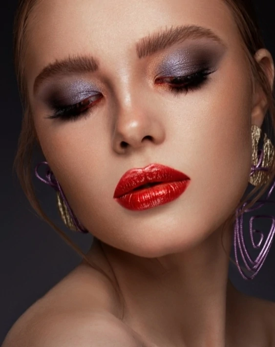 woman with purple eyeshadow and red lipstick