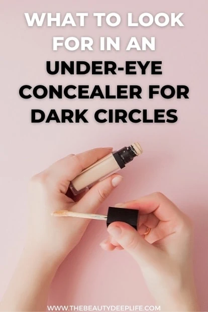 a woman's hands holding liquid concealer with text overlay what to look for in an under-eye concealer for dark circles