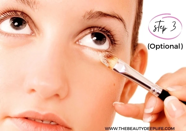 woman using concealer for step 3 of a natural makeup look