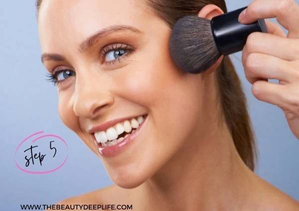 woman using bronzer for step 5 of a natural makeup look