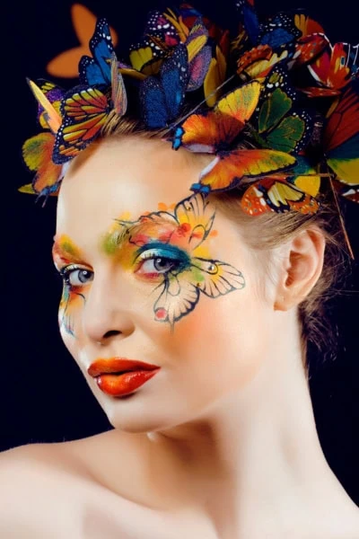 woman with butterfly halloween makeup look