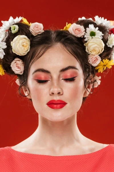 woman with beautiful makeup and flowers in here hair