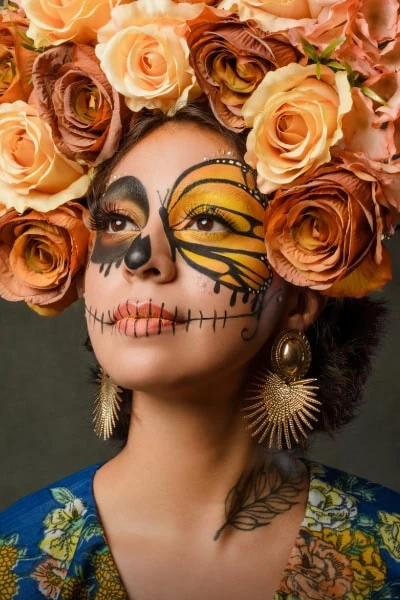 woman with sugar skull butterfly halloween makeup look