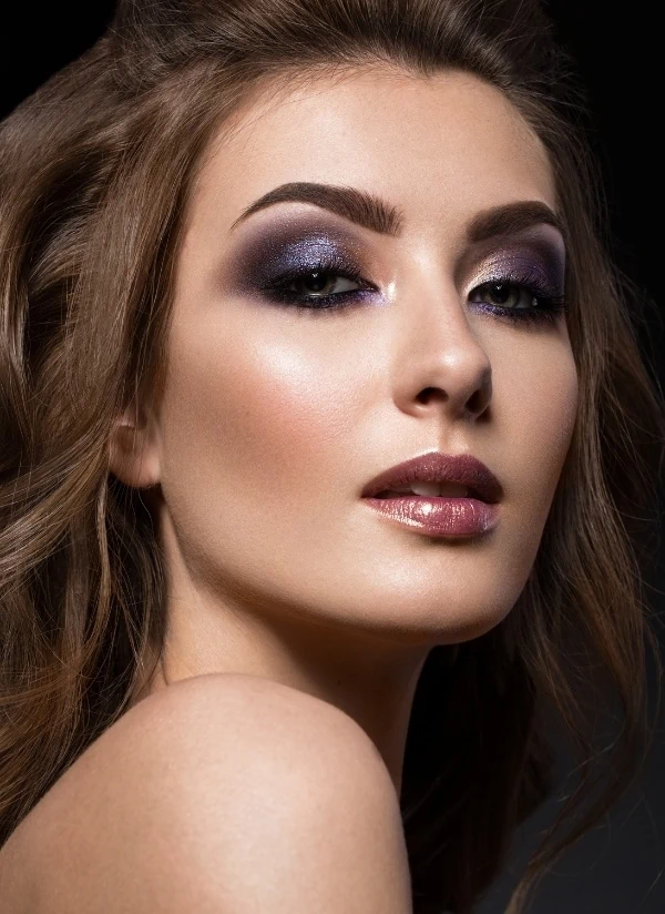 woman with brown eyes and a purple eyeshadow look