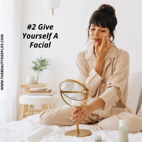 woman showing how to pamper yourself with a facial at home