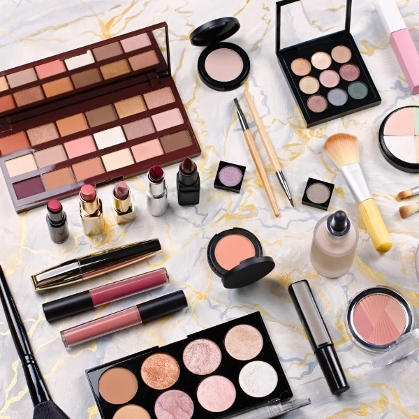 makeup products spread out on a flat surface