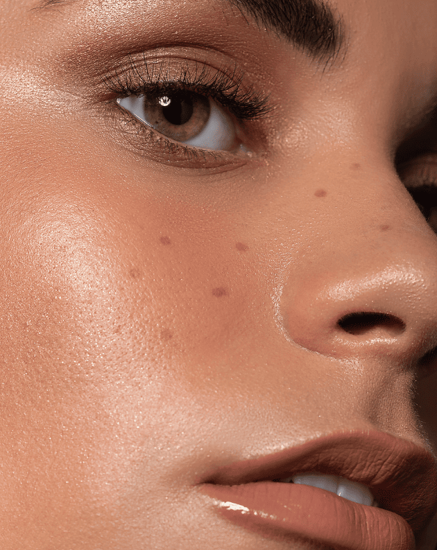 woman with bronze eyeshadow and freckles