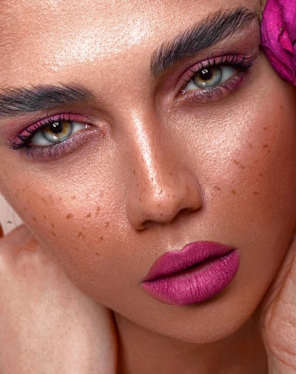 woman with a colorful pink summer makeup look
