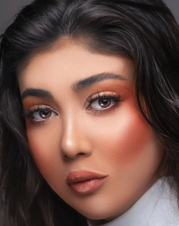 woman with an orange eye makeup look perfect for her brown eyes
