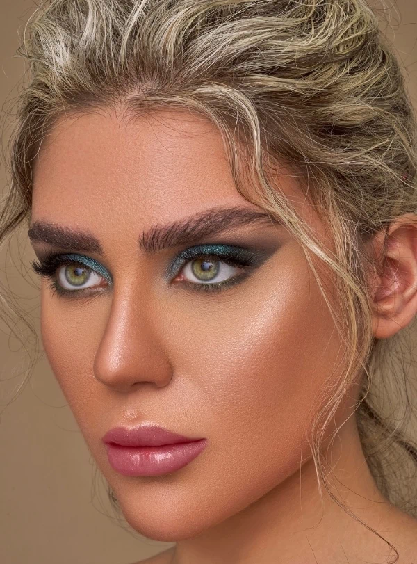 woman with green eyeshadow and green eyes