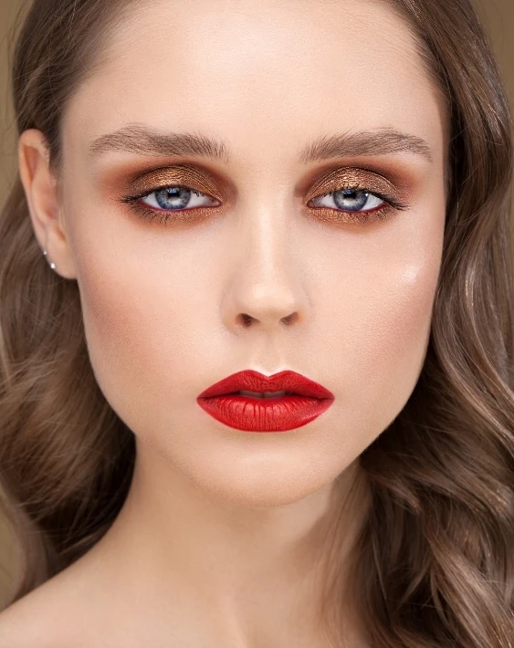 woman with copper eyeshadow and red lipstick