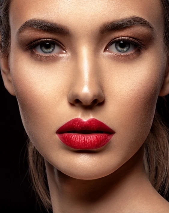 woman with eye makeup and red lips