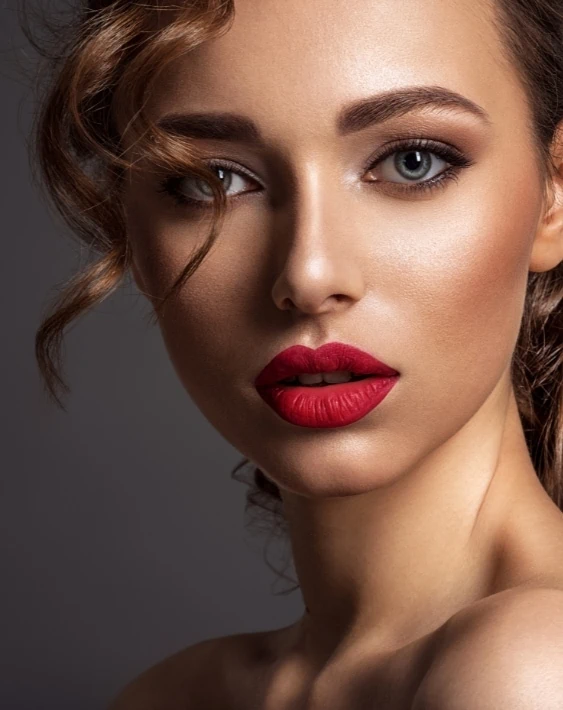 woman with brown and neutral eyeshadow and red lipstick
