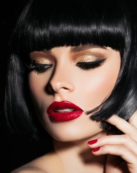 woman with gold eyeshadow and red lipstick
