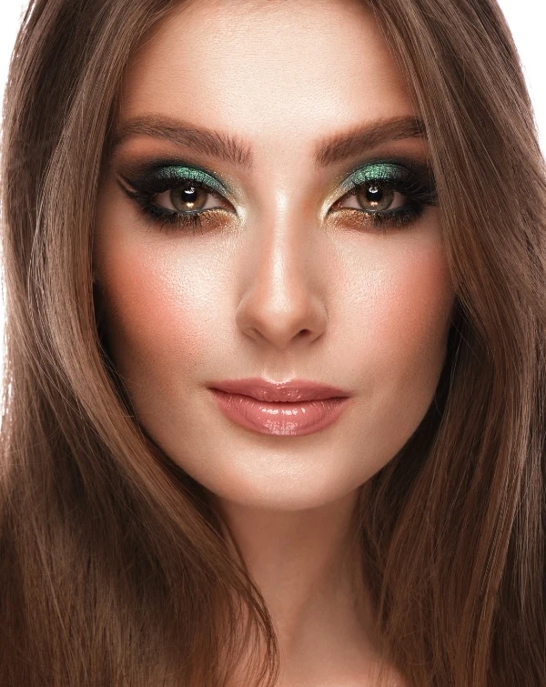 woman with hazel eyes and a green and gold eyeshadow look
