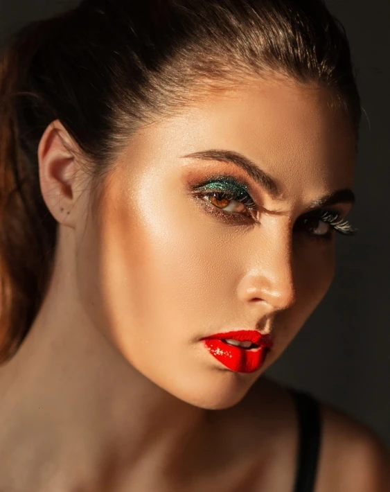 woman with green eyeshadow and red lipstick