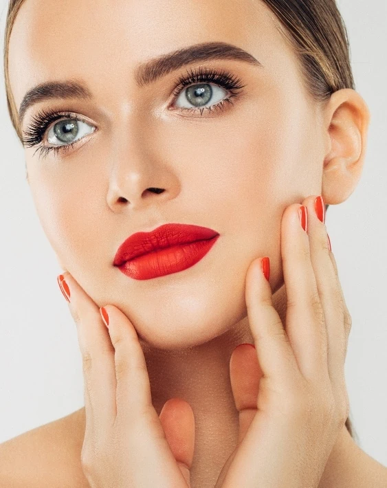 young woman with a natural makeup look and red lipstick