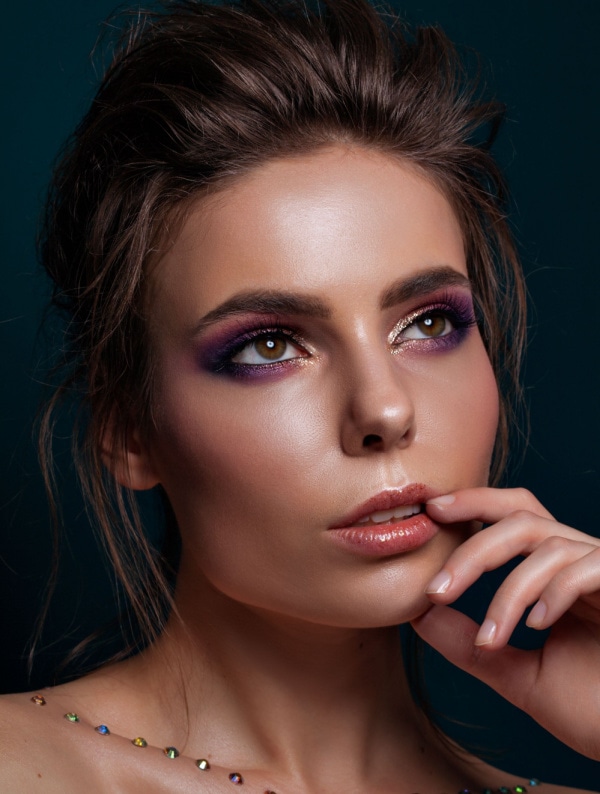 woman with hazel eyes and a pink and purple with gold eyeshadow look