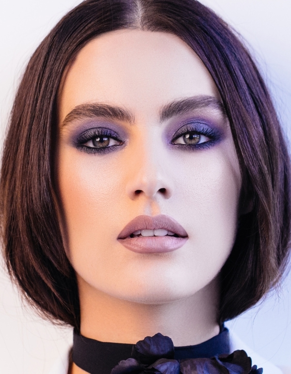 woman with hazel eyes and a dark purple smokey eyeshadow look