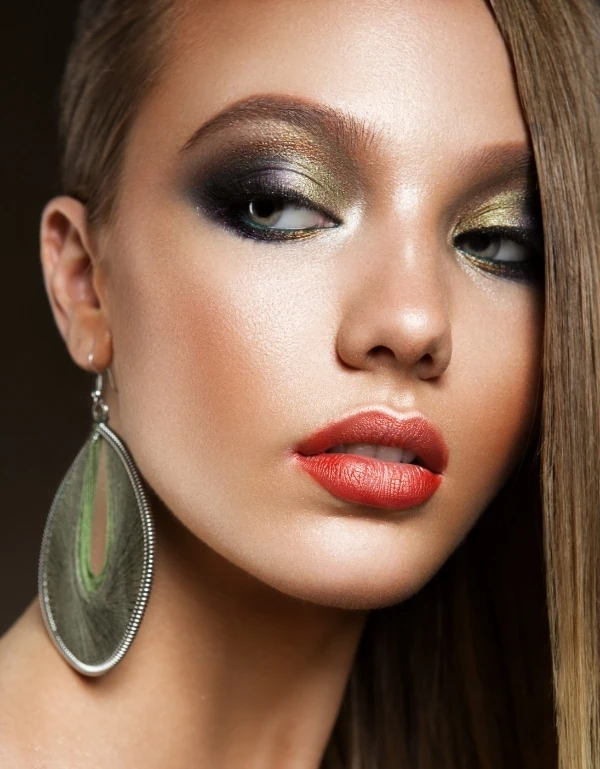 woman with green eyes and light brown hair with a olive green eyeshadow look